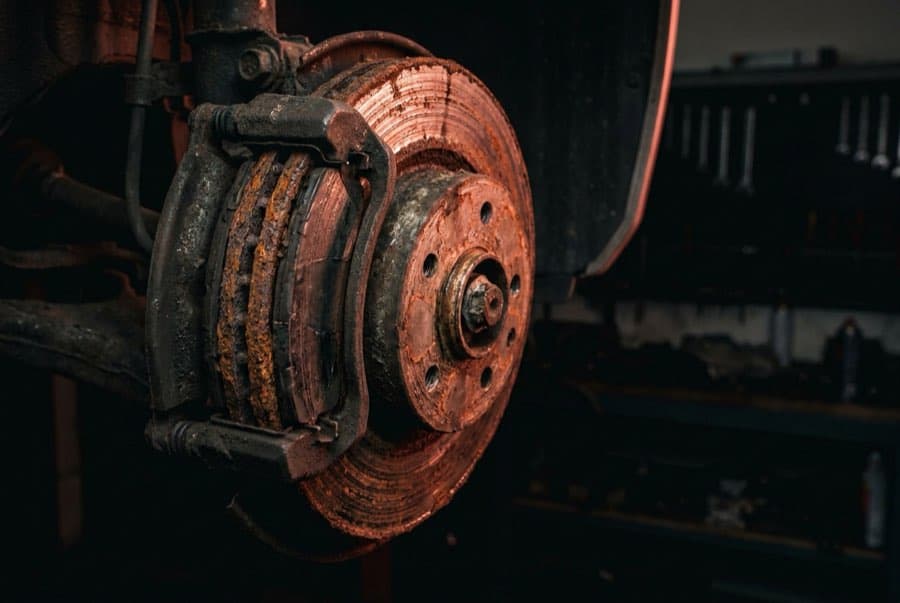Illustrative example: Corroded brake rotor beside a newly installed rotor, before